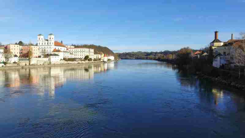 Picturesque view of Passau, Germany by the riverbanks with clear reflections and blue skies., tags: und - pexel